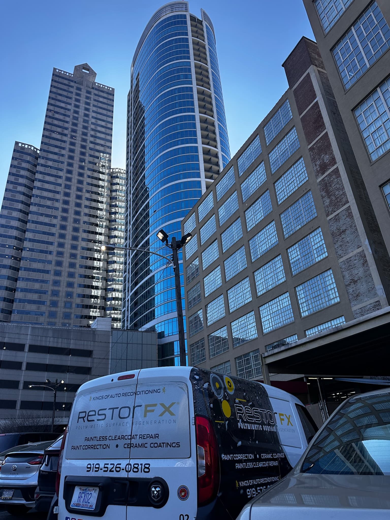Branded commercial van parked in the city