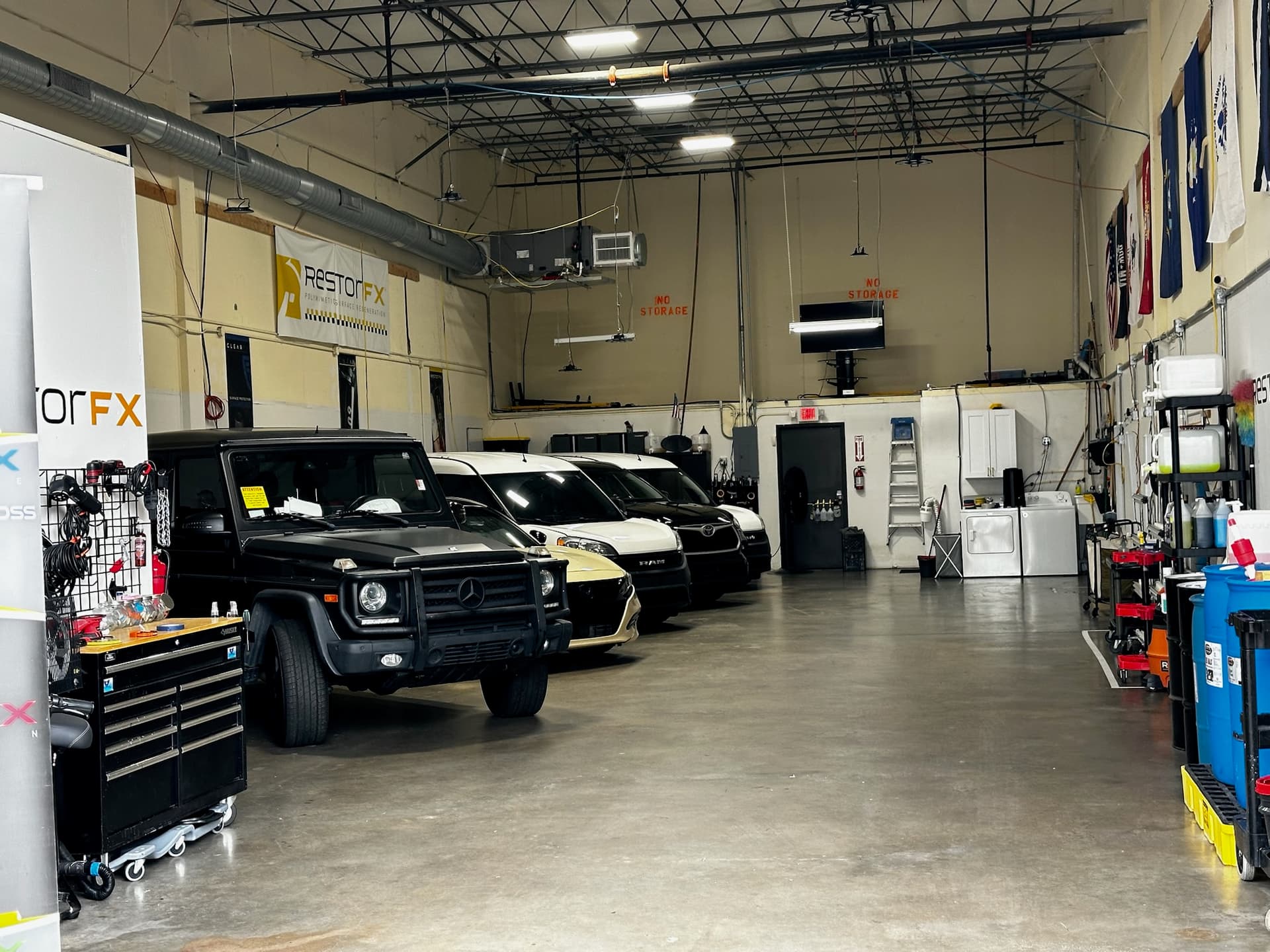 Vehicles inside the KAR FX Customs workshop in Raleigh